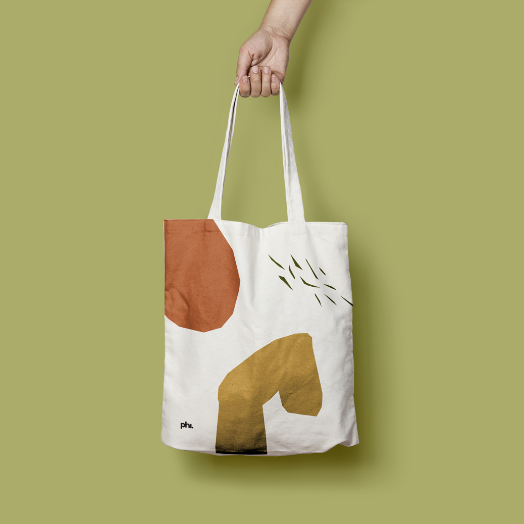 White totebag with visual elements from the branding.